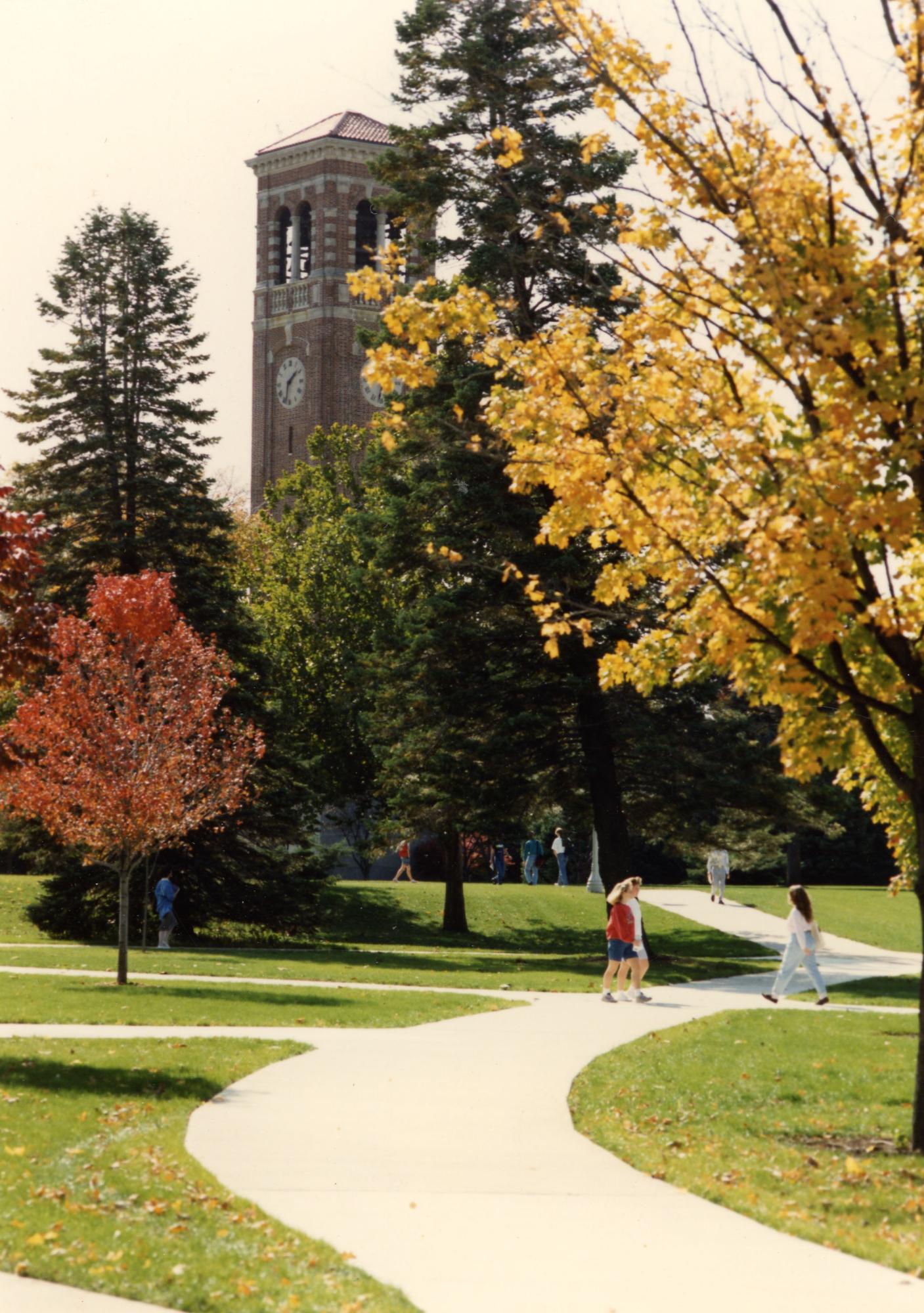 UNI students walking across campus during the fall in the 1980's