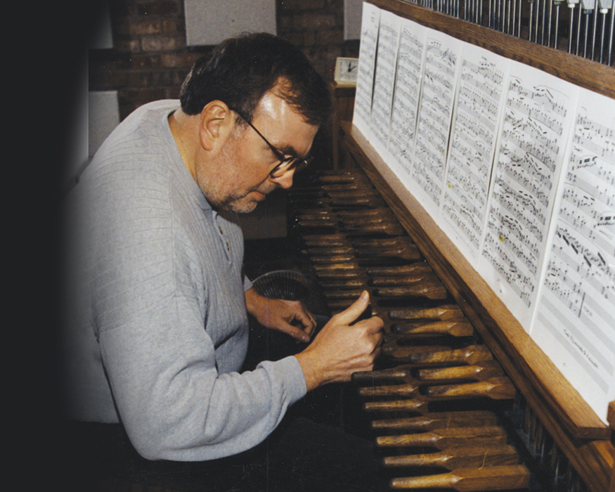Bob Byrnes, the UNI carillonneur, playing the carillon in the UNI Campanile