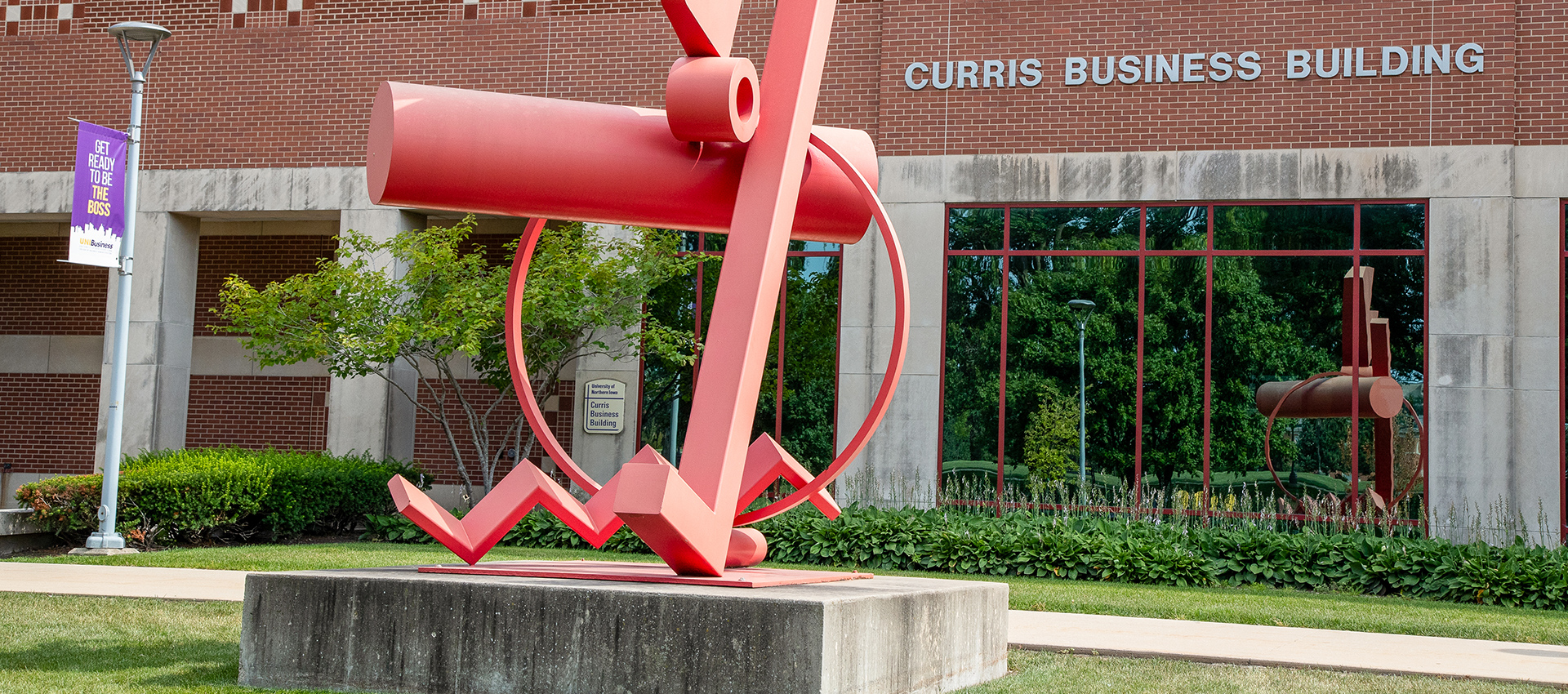 Curris Business Building with a red sculpture in front