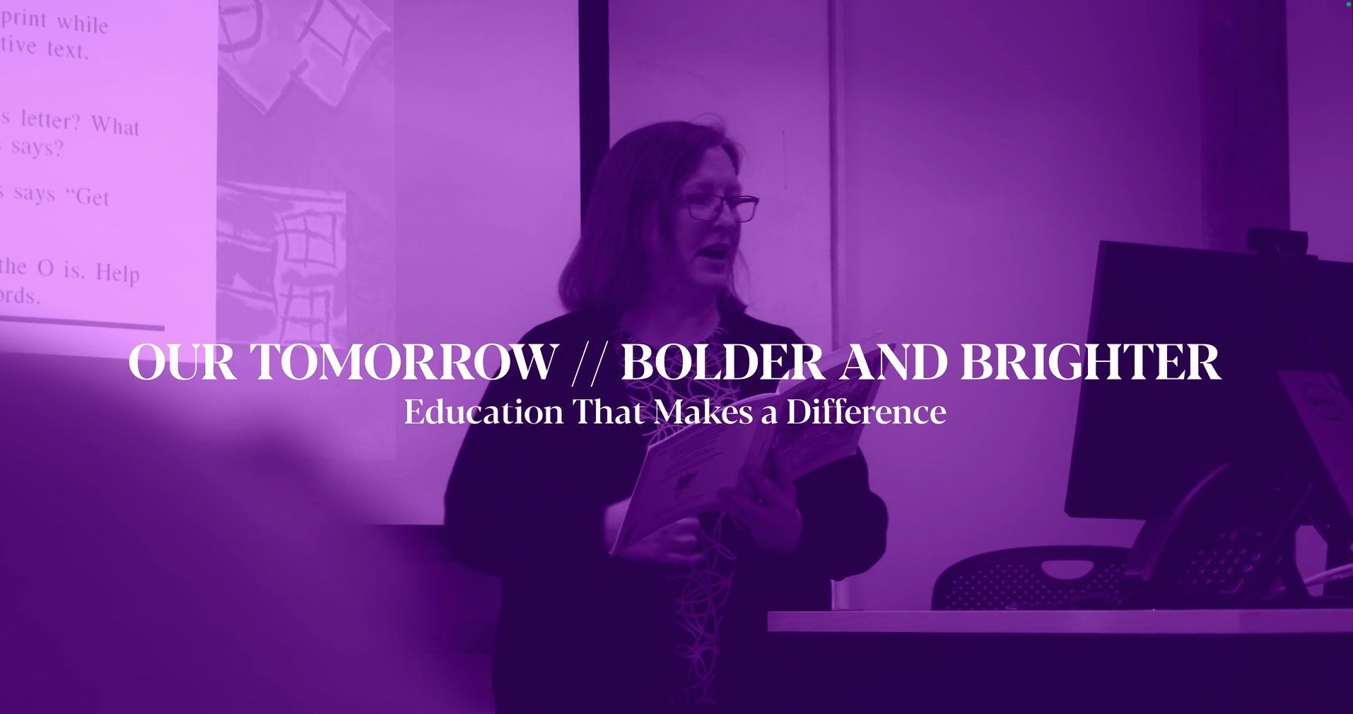 A UNI professor in the classroom with the words Our Tomorrow // Bolder and Brighter. Education That Makes a Difference