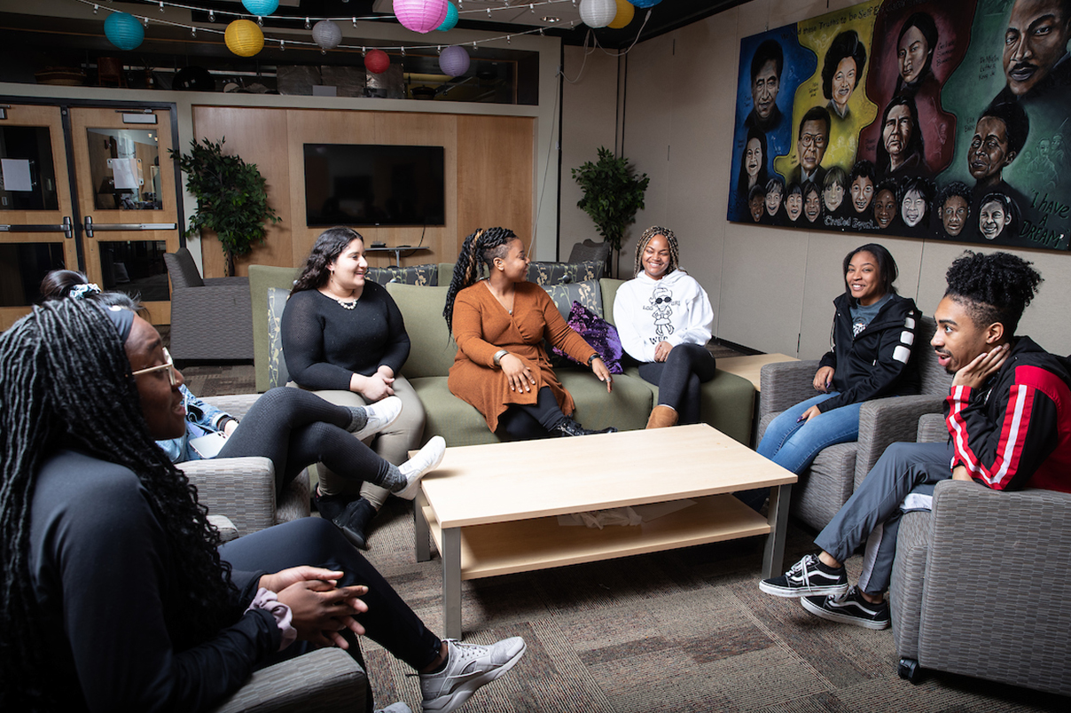 A group of students gathers in the UNI Office of Diversity, Inclusion and Social Justice
